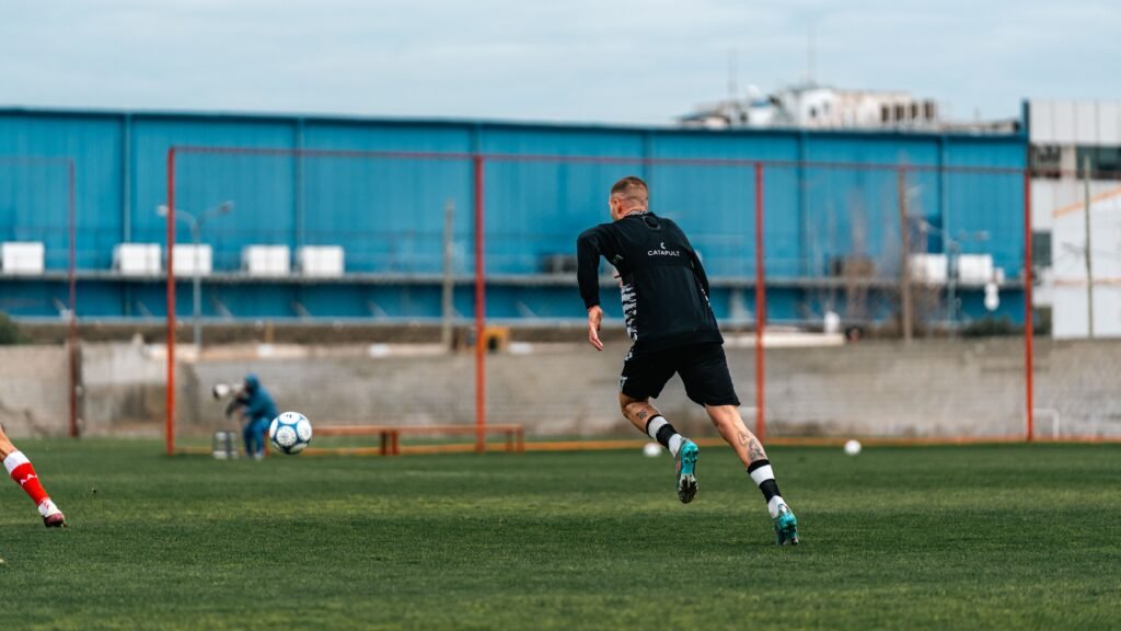 footballer sprinting