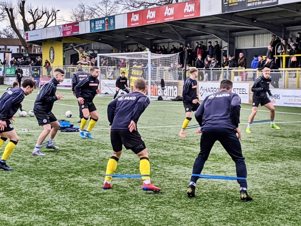 footballers warming up before a game