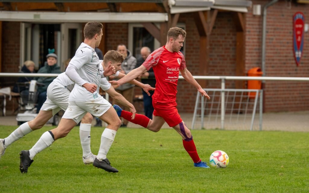 football player striking the ball